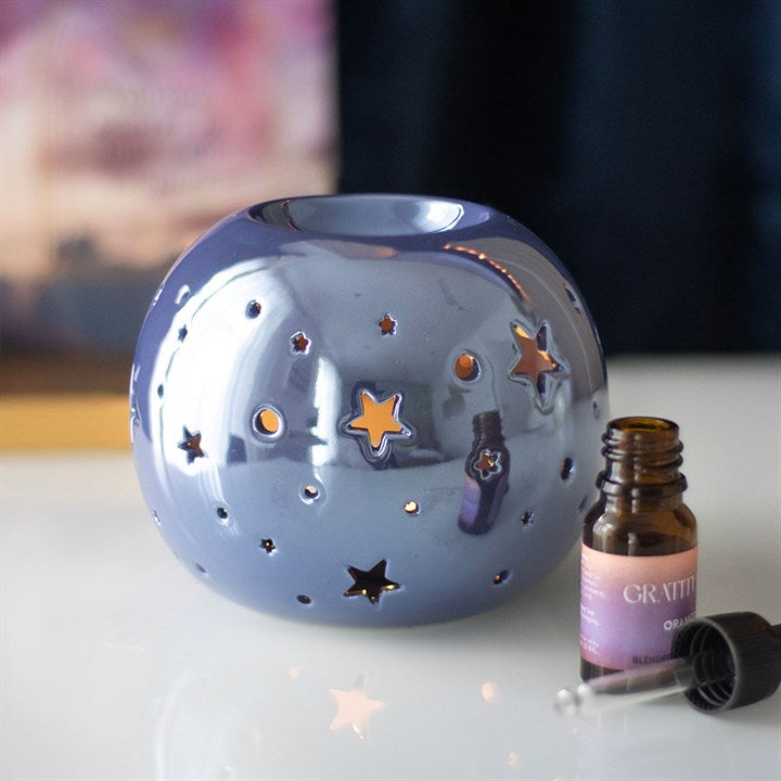 Decorative oil burning sphere, iridescent purple, star projecting lantern, witchy vibes