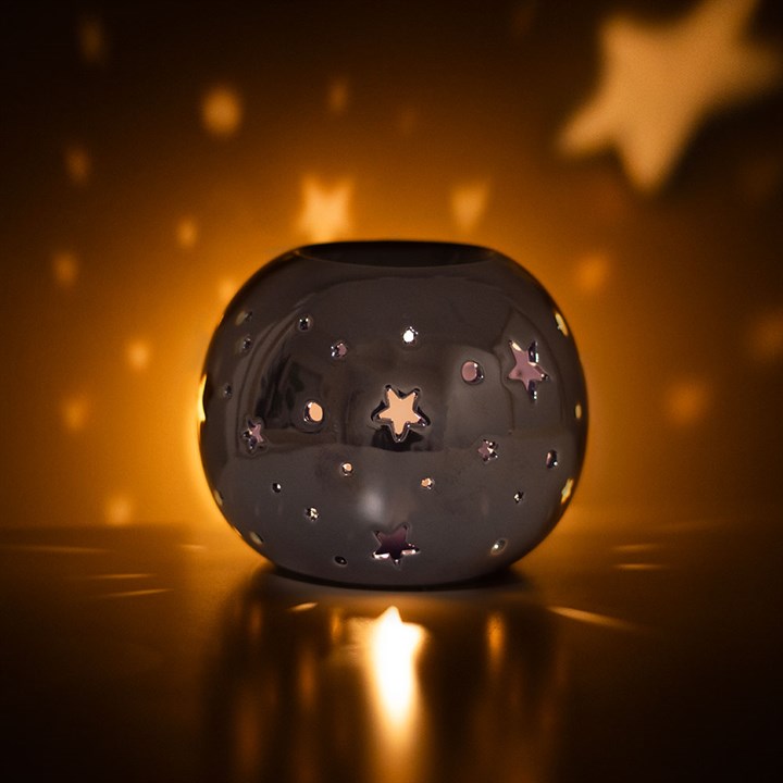 Decorative oil burning sphere, iridescent purple, star projecting lantern, witchy vibes