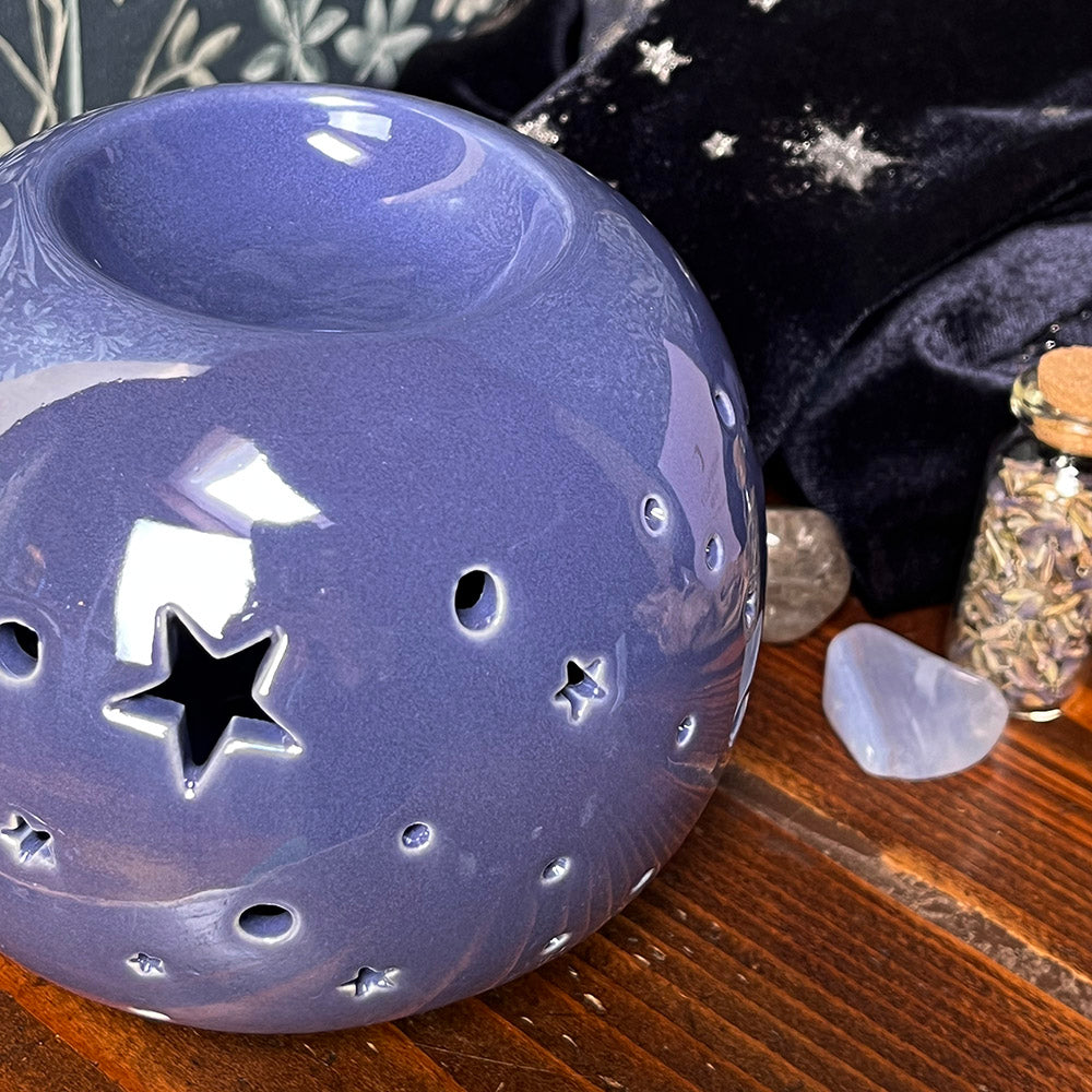 Decorative oil burning sphere, iridescent purple, star projecting lantern, witchy vibes