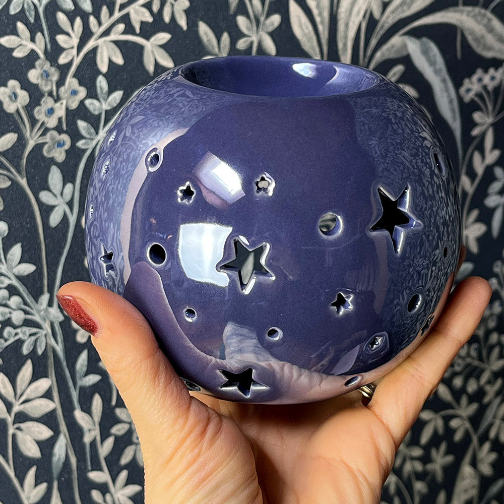 Decorative oil burning sphere, iridescent purple, star projecting lantern, witchy vibes