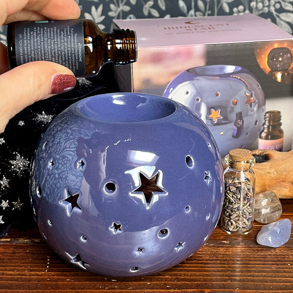 Decorative oil burning sphere, iridescent purple, star projecting lantern, witchy vibes